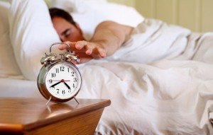 An Alarm Clock waking up turn off alarm clock